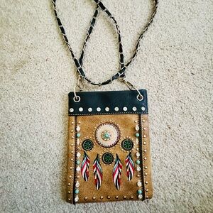 Tan and Black Crossbody Bag with Decorative Tassels